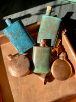 patina flasks in copper tray with other copper products 